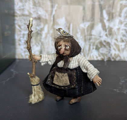 Full-scale view of a handmade gothic miniature — Small Baba Yaga with bird (5/7)