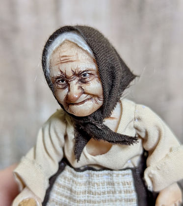 Small doll Granny with chicken
