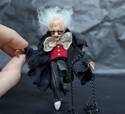 Full-scale view of a handmade gothic miniature — Small doll Vampire (1/10), Acrylic paint, polymer clay, fabric