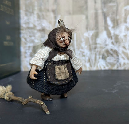 Full-scale view of a handmade gothic miniature — Small Baba Yaga with bird (6/7)
