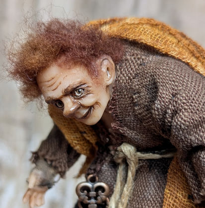 Close-up detail of a handmade gothic miniature — Small art doll Quazimodo, one-of-a-kind sculpture by Ritunia