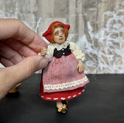 Close-up detail of a handmade gothic miniature — Small art doll Red riding hood, one-of-a-kind sculpture by Ritunia