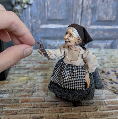 Full-scale view of a handmade gothic miniature — Granny with the bird (4/8), polymer clay, fabric, acrylics, varnish, wool