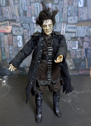 Close-up detail of a handmade gothic miniature — Art doll CaptainSalazar, Acrylic paint, polymer clay, fabric, wool