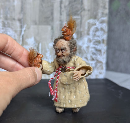 Close-up detail of a handmade gothic miniature — Small art doll Forester, Acrylic paint, polymer clay, fabric, wool