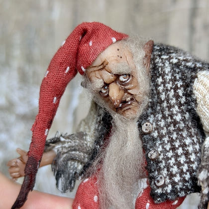 Close-up detail of a handmade gothic miniature — Small art doll Gnome with axe, one-of-a-kind sculpture by Ritunia
