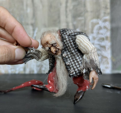 Full-scale view of a handmade gothic miniature — Small art doll Gnome with axe (3/10), one-of-a-kind sculpture by Ritunia