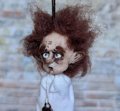 Close-up detail of a handmade gothic miniature — Small art doll Little ghost