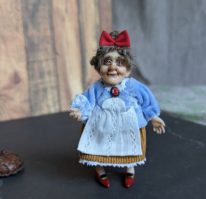 Full-scale view of a handmade gothic miniature — Small doll Granny with bread (9/9)
