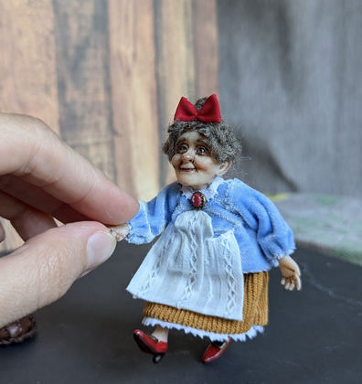 Full-scale view of a handmade gothic miniature — Small doll Granny with bread (3/9)