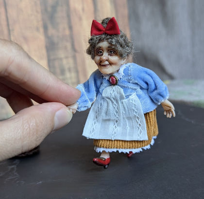 Full-scale view of a handmade gothic miniature — Small doll Granny with bread (8/9)
