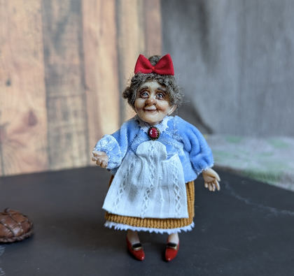 Full-scale view of a handmade gothic miniature — Small doll Granny with bread (7/9)