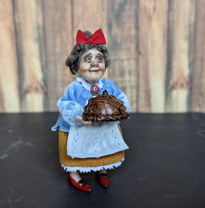 Small doll Granny with bread