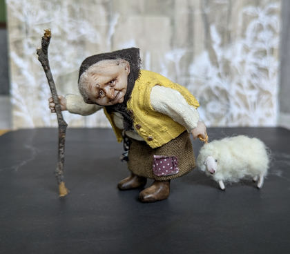 Small doll Granny with her sheep